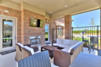 Outdoor lounge with tv and fireplace